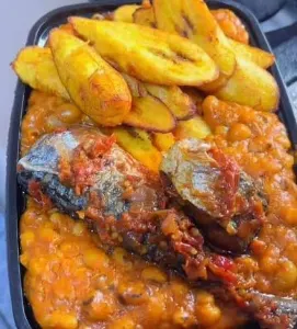 Beans pourage with plantain and fish